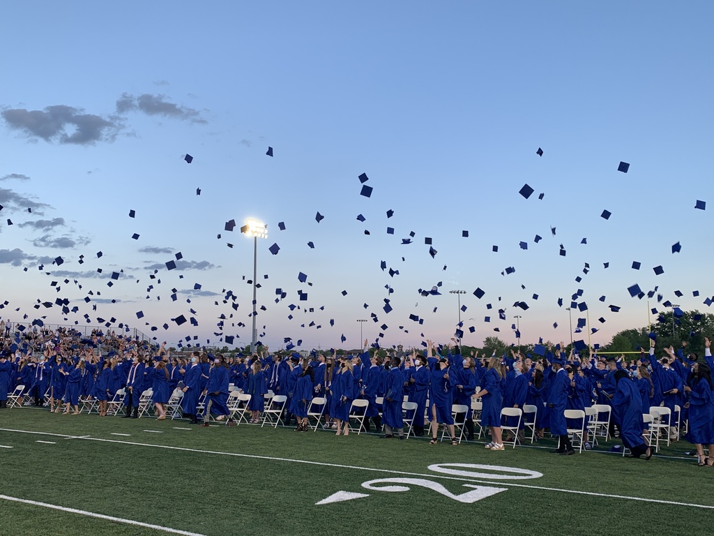 LWE Graduates Throwing Caps in Air
