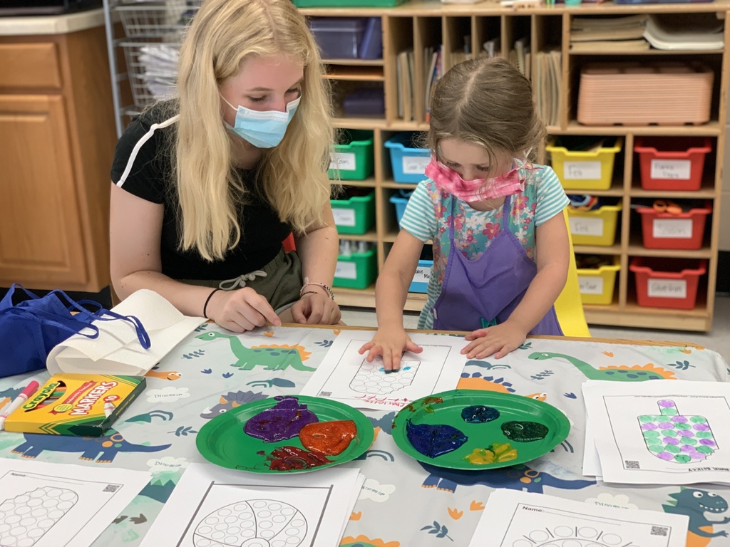 Preschool students finger painting