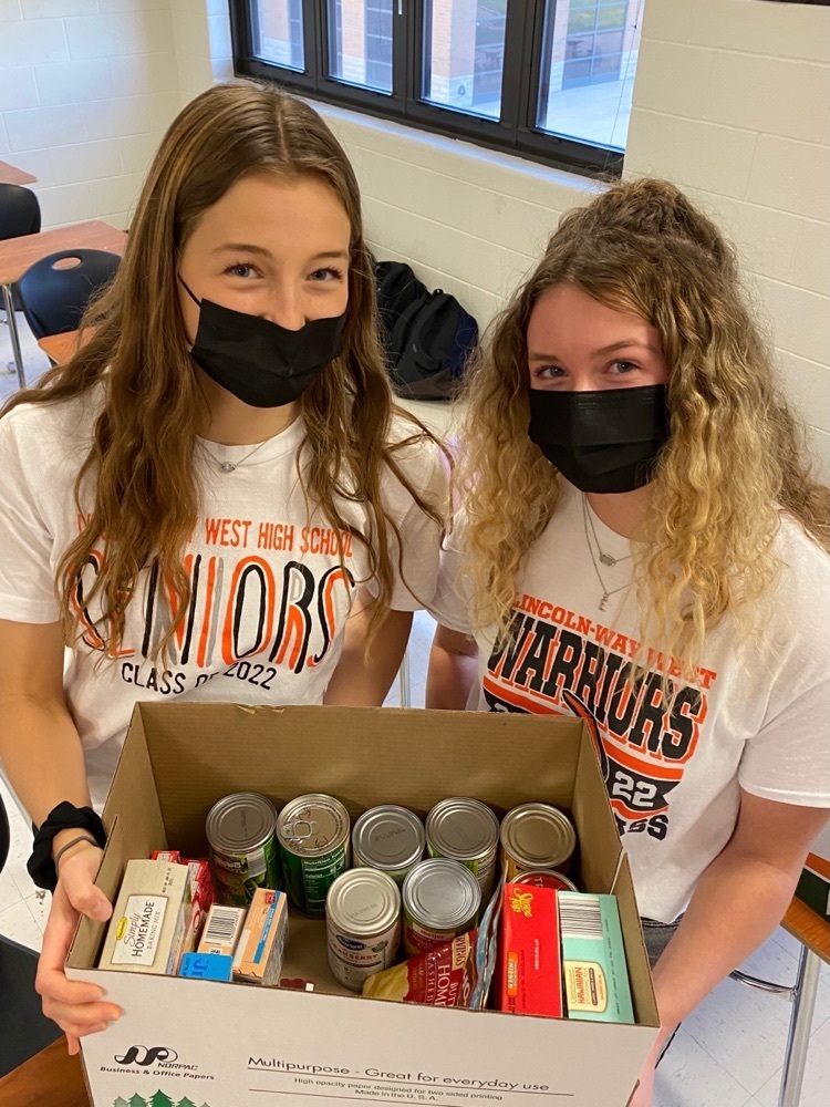 students with food drive items