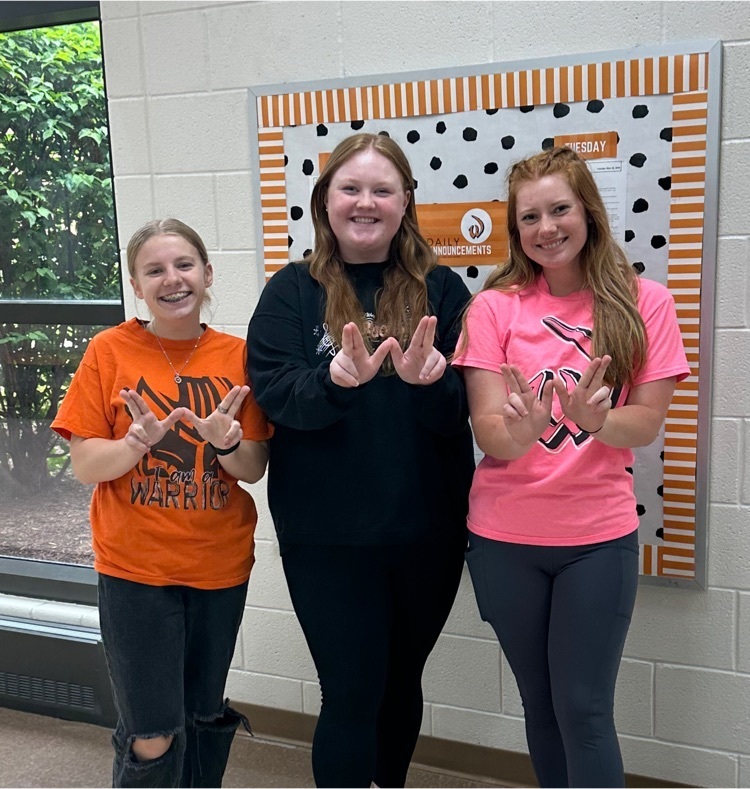 students wearing orange